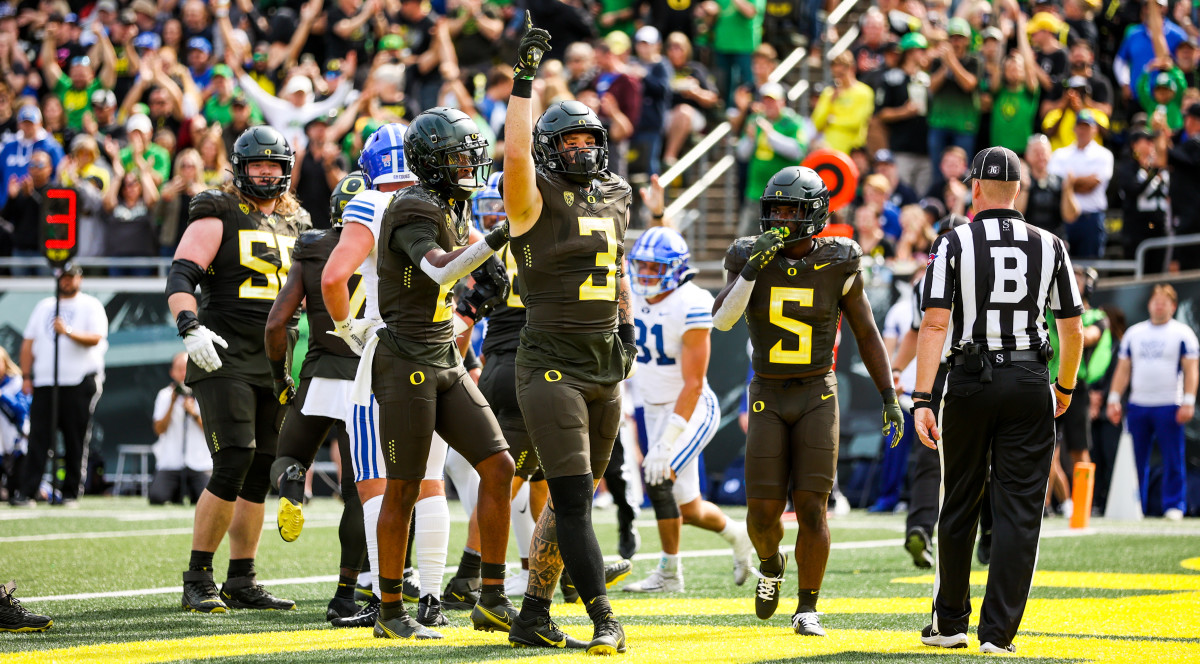 Oregon tight end Terrance Ferguson celebrates an Oregon touchdown against the BYU Cougars. 